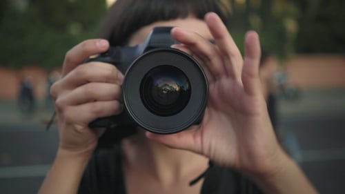 Close up of Person Holding Camera