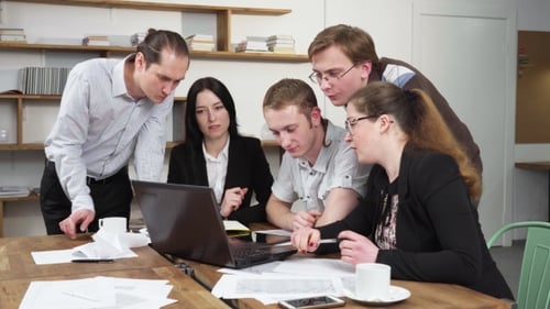 Team of Business People During Business Meeting in Office