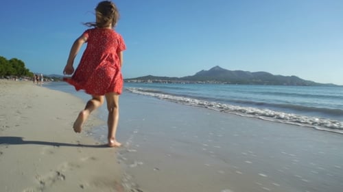 red dress lady beach running Beautiful Young Woman Running Beach Camera Red Dress Stock Photo KM-Photography #205725184