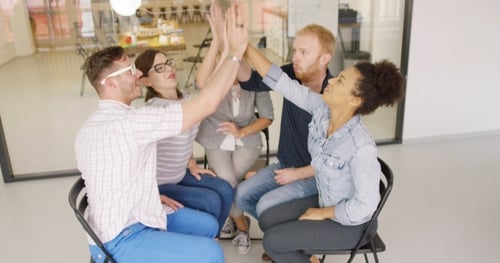 Diverse Colleagues Celebrating Success in Office