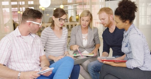 Collaborative Team Meeting in Modern Office Space