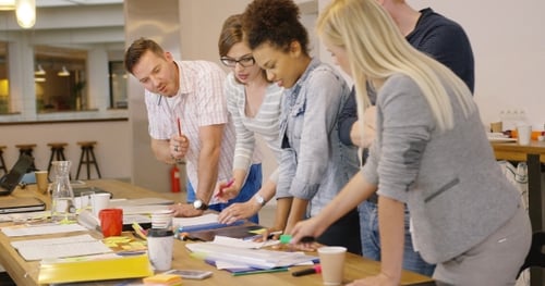 Creative Team Brainstorming Ideas in Modern Workplace