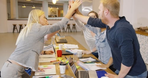 People High-fiving in Office