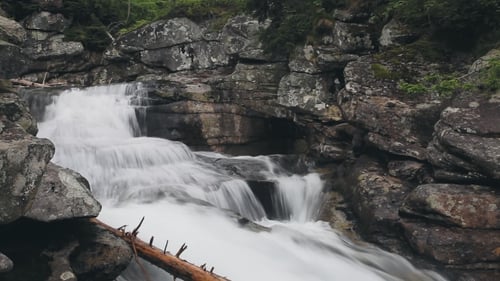 Mountain River with Cascade Waterfall in Forest