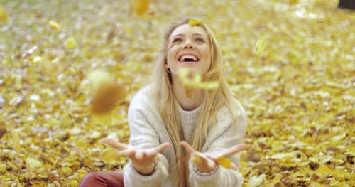 Woman Rejoicing at Falling Leaves
