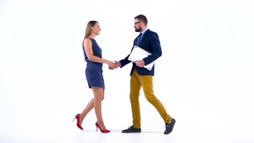 Two Business Partners Shake Hands Welcoming Each Other in Studio.