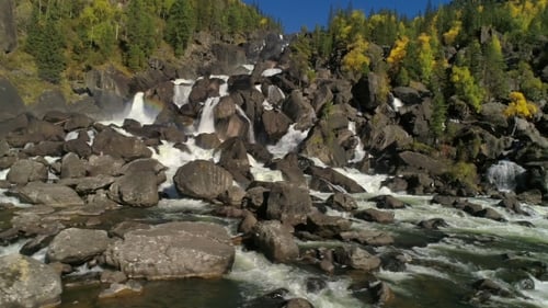 Aerial View of Waterfall, Flying Over Autumn Forest, Waterfall with Big Stones
