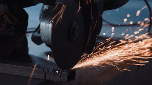 Close Up of Tool Cutting Metal with Sparks