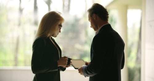 Business Meeting Discussion Over Digital Tablet