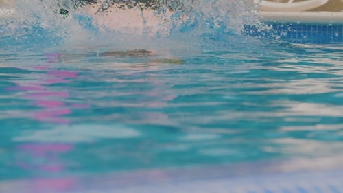 Man Jumping Into Swimming Pool
