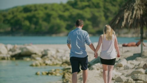 Couple Walking on Sea Shore