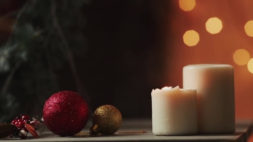 Christmas Ornaments and Candles Being Extinguished