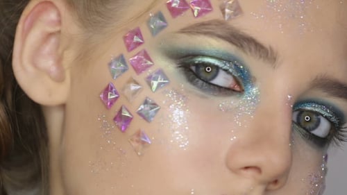 Fashion Makeup Woman with Colorful Makeup and Body Art