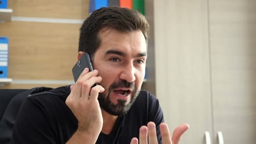 Man Talking on Phone in Office Close Up