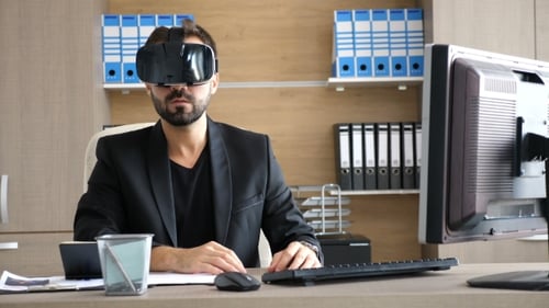 VR Technology - Young Businessman in the Office Wearing Virtual Reality VR Headset