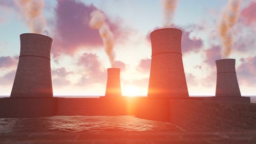 Industrial Power Plant Emissions with Ocean Sunset
