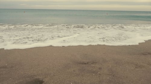 Sea Waves on the Seaside at the Sunset