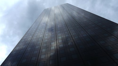 Cloudy Sky Reflecting on Modern Skyscraper Facade
