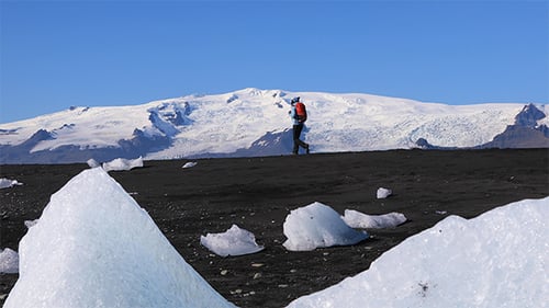 Young Woman Walking on Black Sand Iceberg Beach