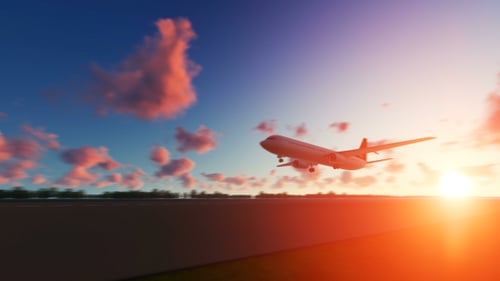 The Plane Landing to Miami City in USA at Sunset
