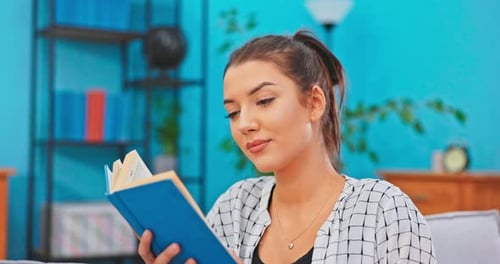 Woman Reading a Book Indoors