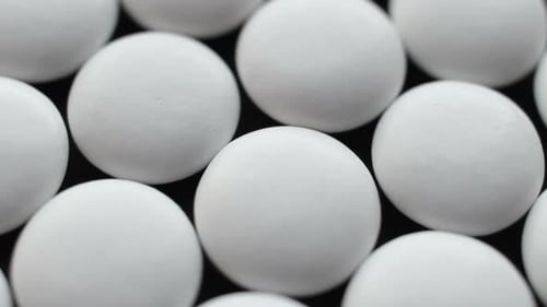 Medical Pills Placed on Rotating Table, Close Up