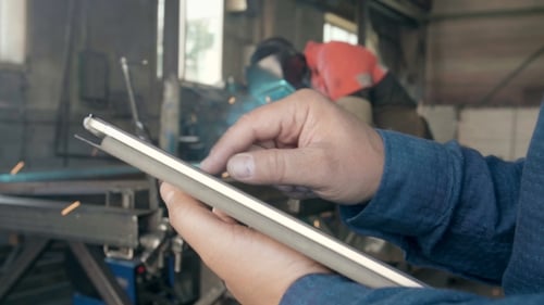 The Engineer on Manufacture with a Tablet