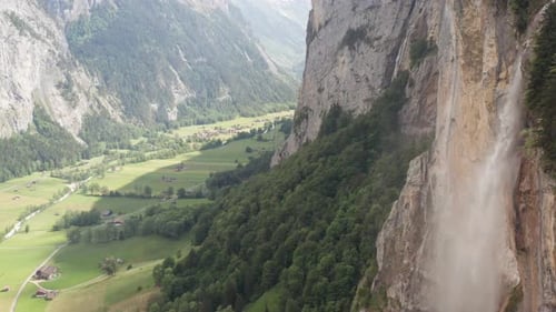 Scenic Mountain Valley With Waterfall Aerial View