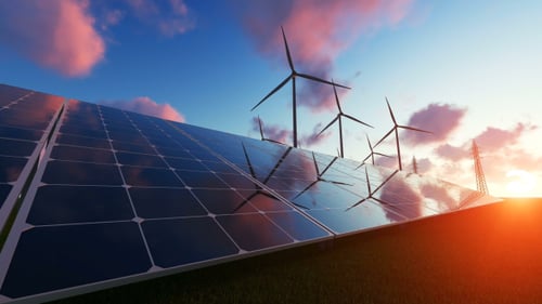 Renewable Energy Landscape with Solar Panels and Wind Turbines at Sunset