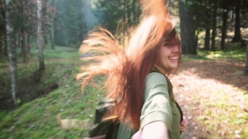 Follow Me To the Adventures. Young Beautiful Red-haired Girl with a Backpack. Follow the Adventure