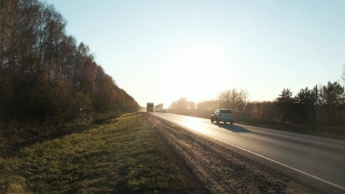 18 Wheel Truck on the Road with Sunset in the Background. Large Delivery Truck Is Moving Towards