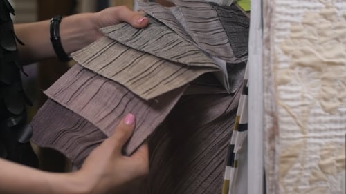 Female Client in Interior Design Studio Looking at Fabric Samples