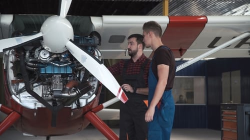 Two Flight Mechanics Doing a Pre Flight Check