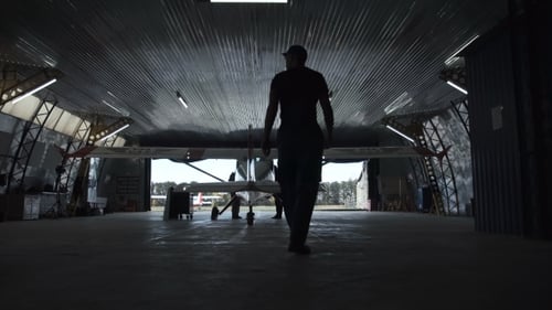 Person Walking Towards Plane