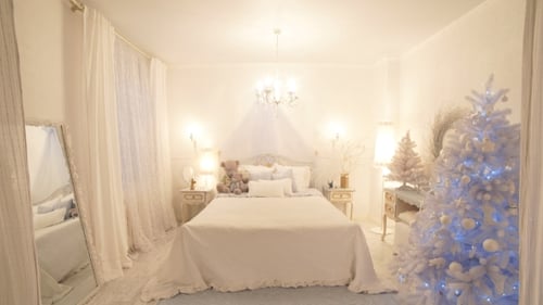 Christmas Bedroom Decorated in White with Christmas Tree
