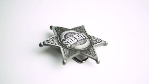 Antique Sheriff Badge on White Background