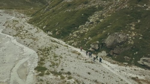 Tourist Group Hiking on Mountain Trail. Mountain Tourism