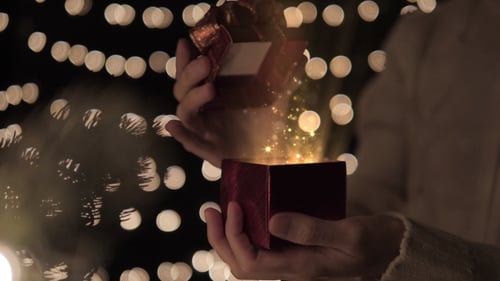 Magical Gift Box Opening with Sparkling Particles for Celebrations