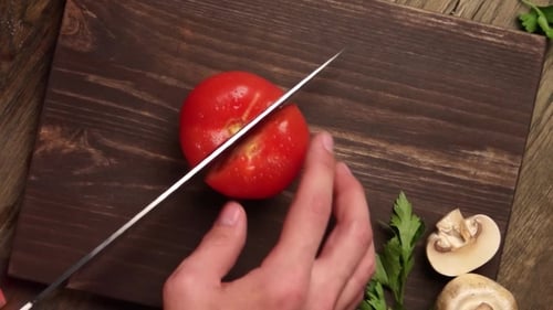 The Chef Hands Slicing Vegetables by Knife