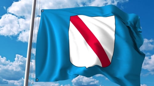 Light Blue Regional Flag Waving with White Shield and Red Diagonal Band