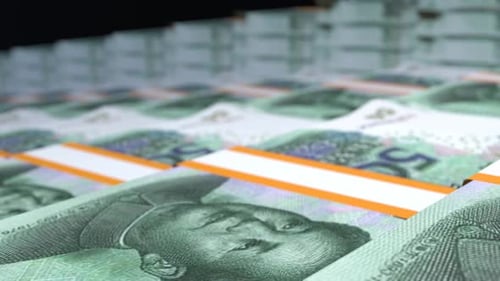 Many wads of money. 50 Chinese Yuan banknotes. Stacks of money.