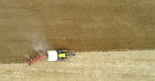 Tractor Plowing Field