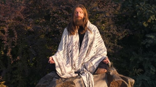 Man Meditating on Rock in Nature Setting