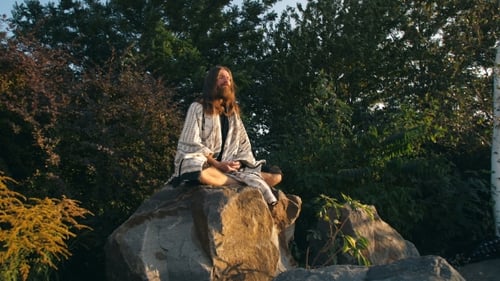 Yogi Sitting on the Rock and Meditating