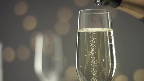 Bubbly Champagne Poured into Glass