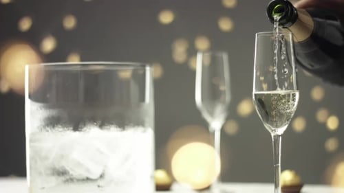Sparkling Wine Being Poured into Champagne Glass