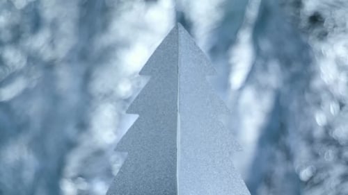 Silver Paper Christmas Tree with Glittery Bokeh