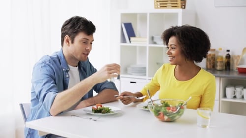 Happy Couple Eating Vegetable Salad at Home 24