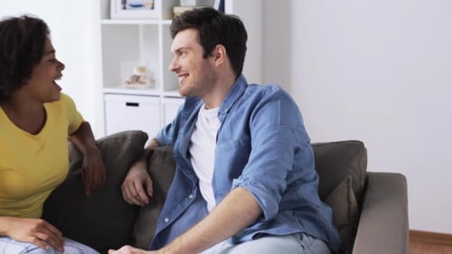 Young Adults Talking on a Couch