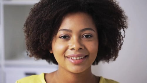 Smiling Woman Close-Up with Curly Hair